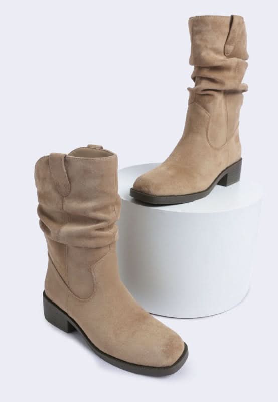 Taupe faux suede slouch mid-calf boots with block heel on white display stand-AVAH