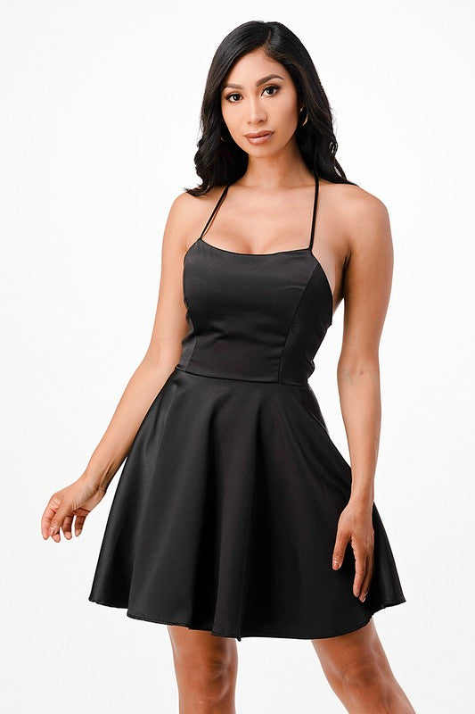 Black skater dress with thin straps and fitted bodice front view