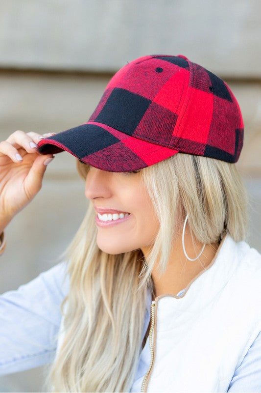 Side view of red buffalo plaid hat showing low-profile structured crown and adjustable closure.