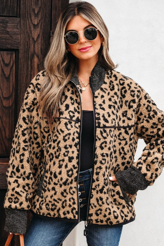 woman wearing leopard zip-up sherpa jacket front view with sunglasses