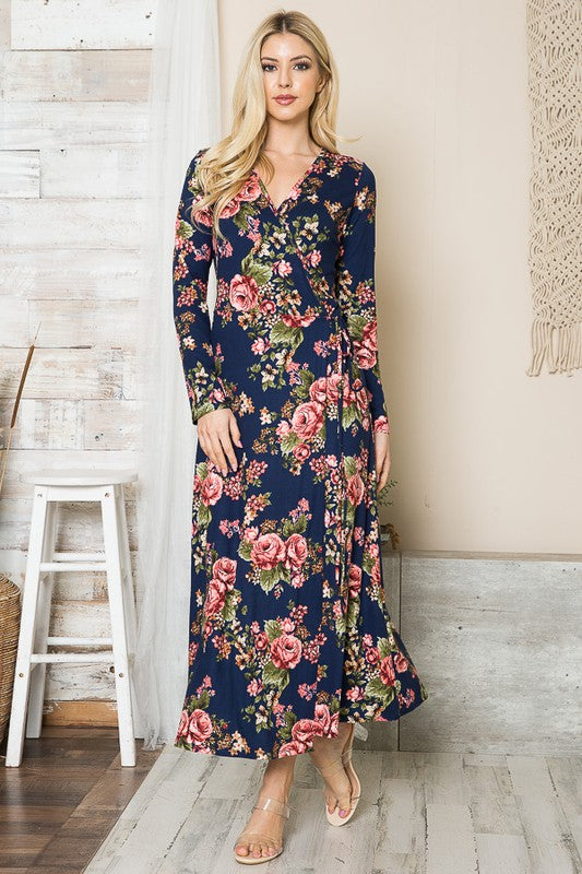 Woman in navy floral long sleeve wrap dress, hands down
