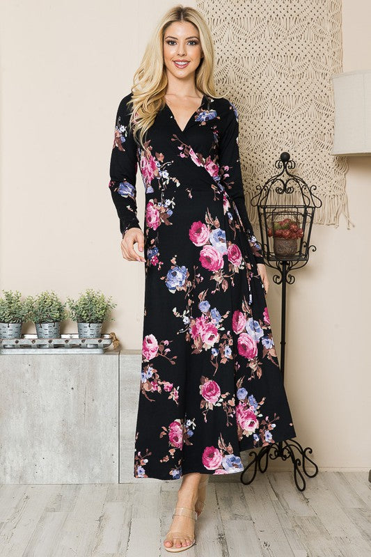 Woman modeling black floral maxi dress with true wrap silhouette