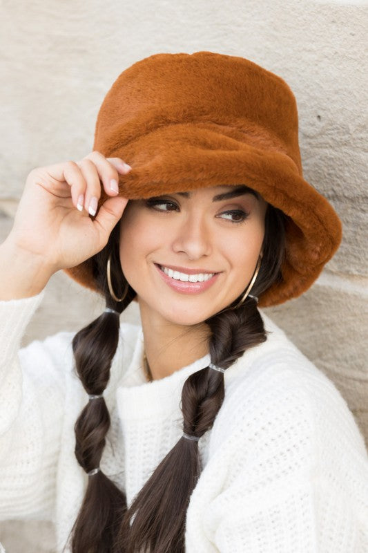 Model wearing camel plush bucket hat with soft faux-fur texture, front view-AVAH
