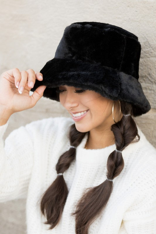Side view of black faux-fur bucket hat