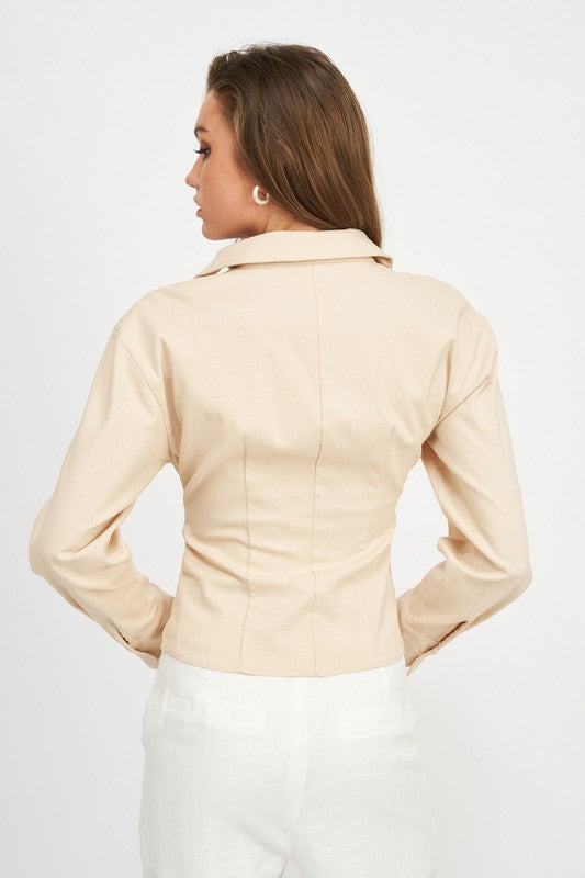 AVAH beige blouse back view showing smooth tailored panel and long sleeves