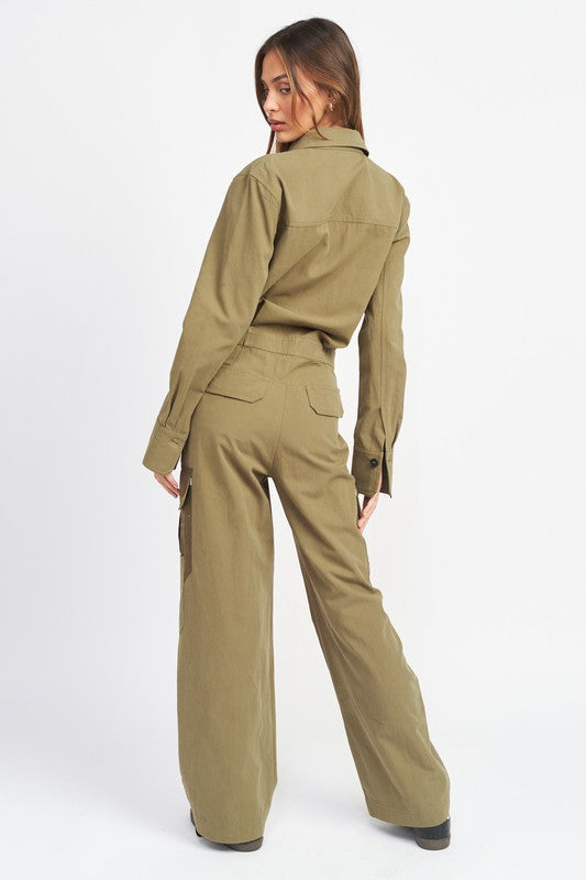Back view of olive green utility jumpsuit with flap back pockets and contrast cargo details.