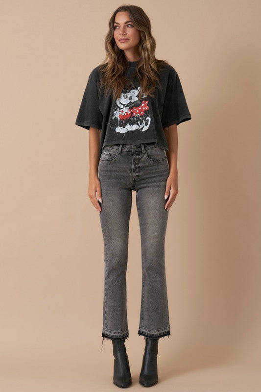 Model wearing grey high-rise crop boot jeans with black graphic tee – front view