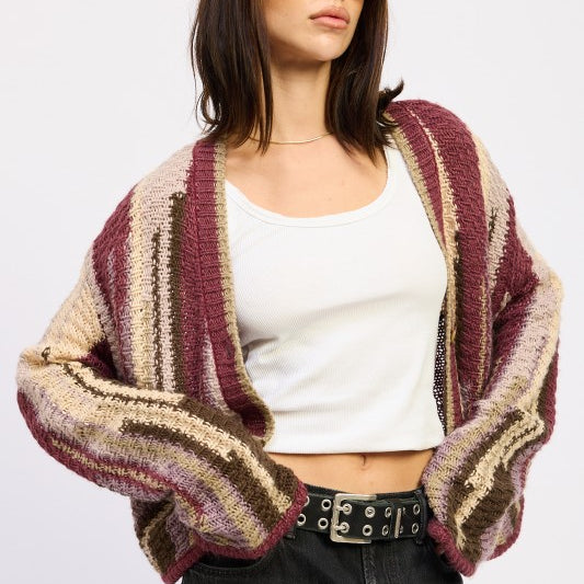 Model wearing burgundy striped open-knit cardigan with white tank and black jeans -AVAH