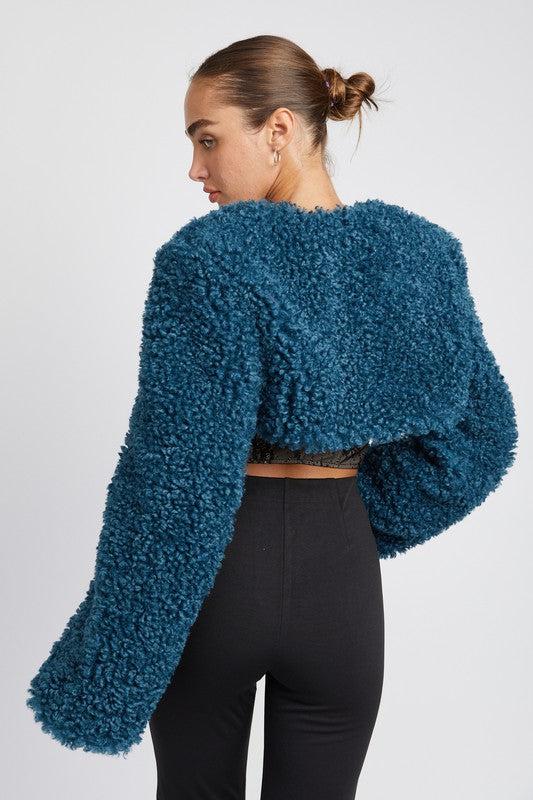 Back view highlighting plush texture and cropped silhouette