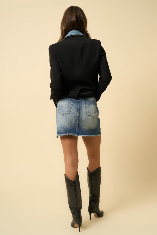 back view of denim mini skirt showing pocket detail