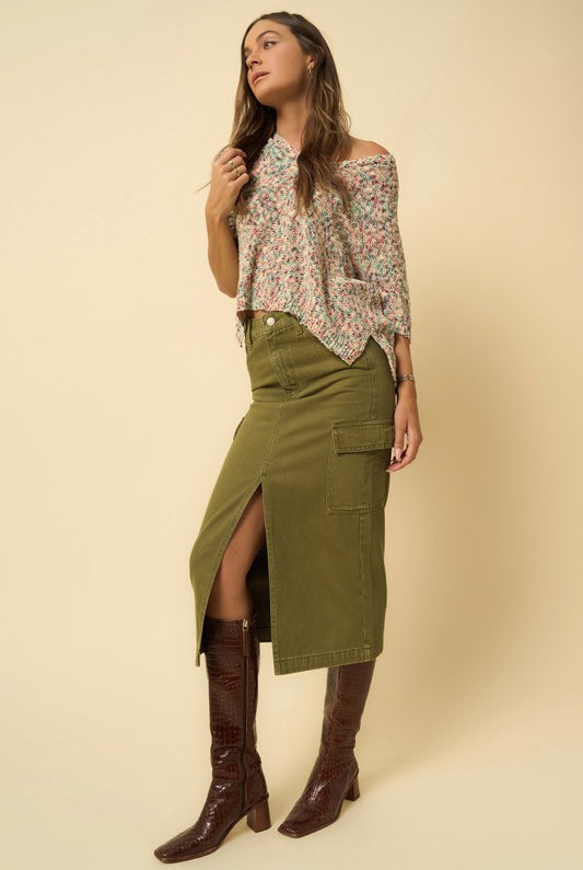 Side angle of olive cargo midi skirt featuring front slit detail.