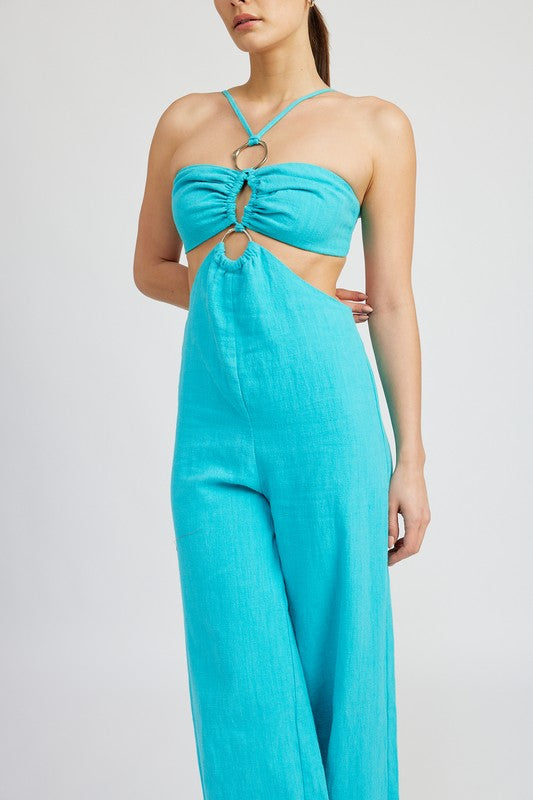 Close-up of front ring and cutout detail on turquoise wide-leg jumpsuit