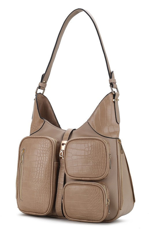 Taupe croc-embossed vegan leather handbag with adjustable strap and multiple compartments.