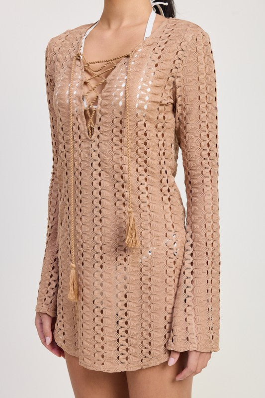 Side angle close-up showing the texture and tassel ties of the tan open-knit cover-up