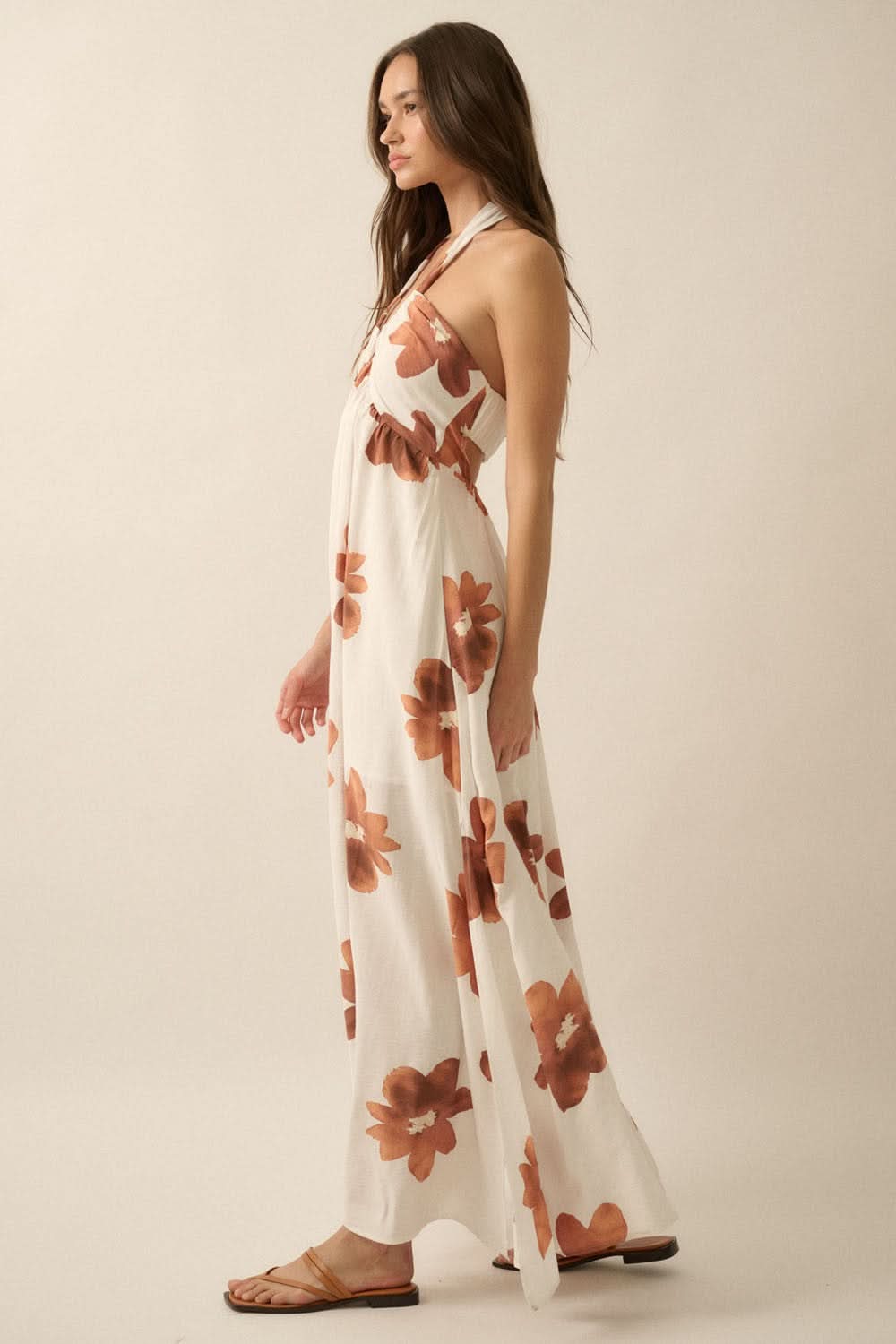 Side studio view of Eden Floral Maxi Sundress showing halter tie and relaxed silhouette