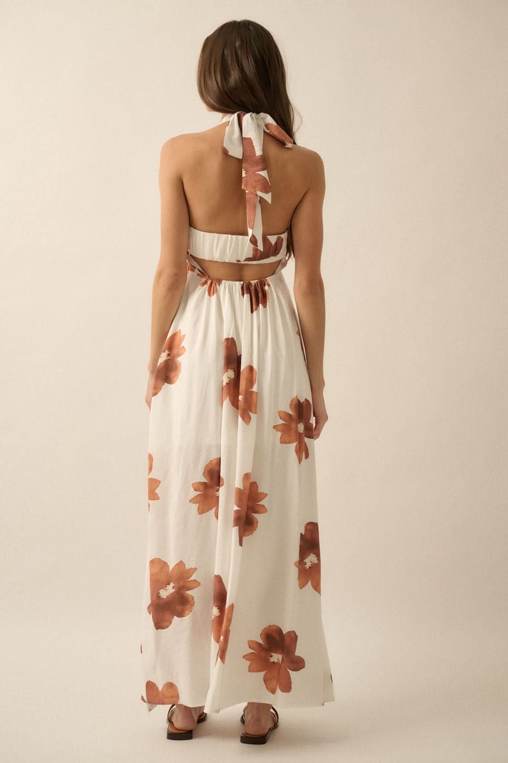 Back studio view of Eden Floral Maxi Sundress with open back and wide tie strap