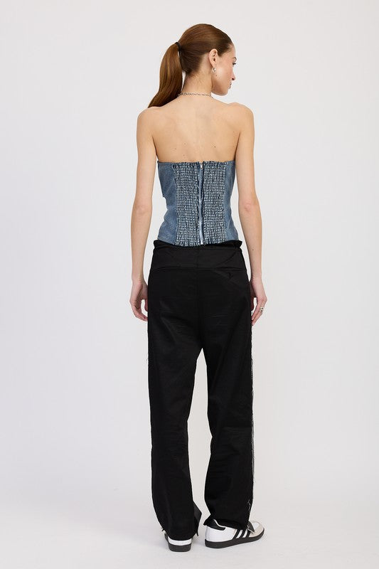 Back view of strapless denim top showing ruched smocking and exposed zip closure