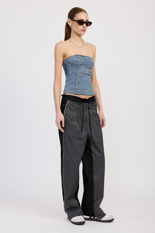 Side angle view of denim bustier-style top with structured fit and smocked back