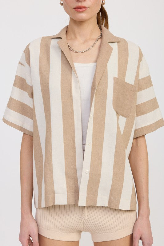 Close-up front view of mocha and ivory striped button-up top showing front patch pocket, drop shoulders, and short sleeves