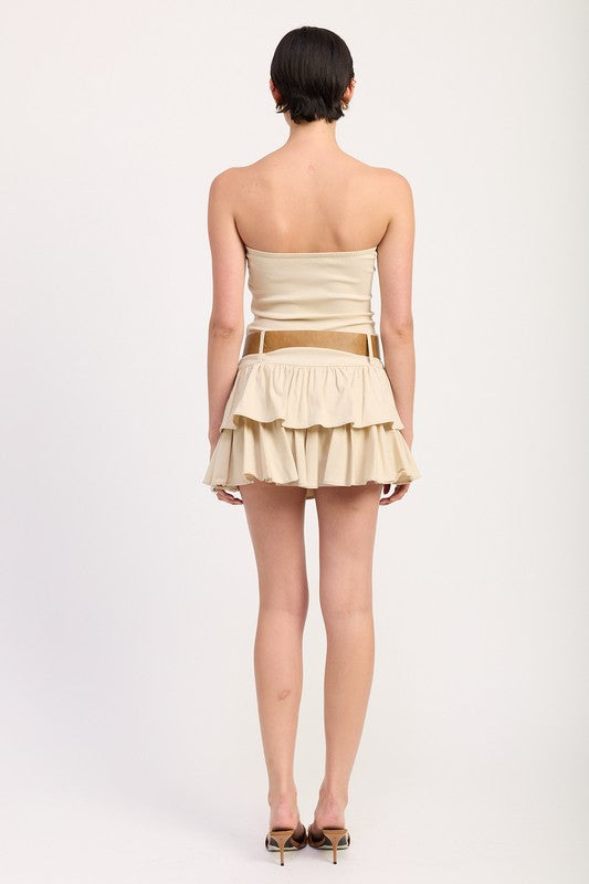 Back view of strapless beige ruffle mini dress with soft shirring and belt detail