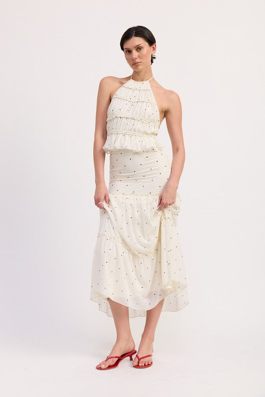 AVAH-Front view of tiered ivory maxi skirt with black polka dots styled with matching top and red sandals