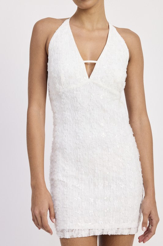 Close-up of floral lace texture and halter neckline with strap detail