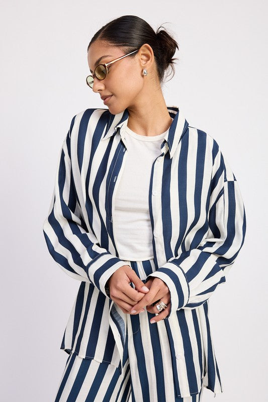 Front view of relaxed striped button-up shirt with drop shoulders and longline fit