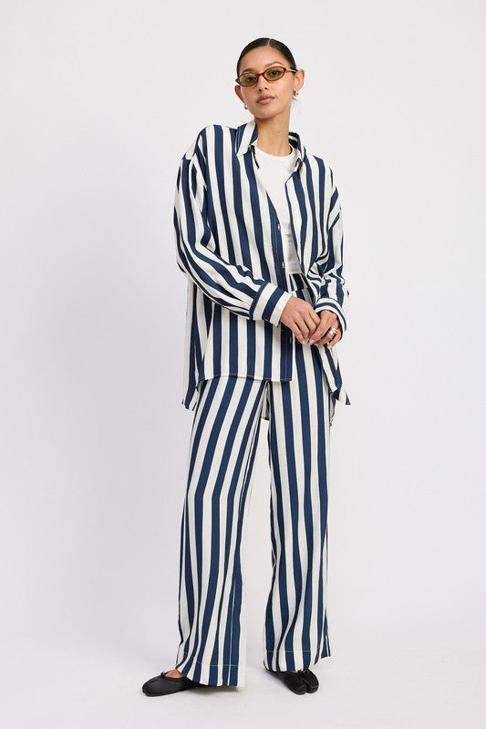 Front view of relaxed striped button-up shirt with drop shoulders and longline fit