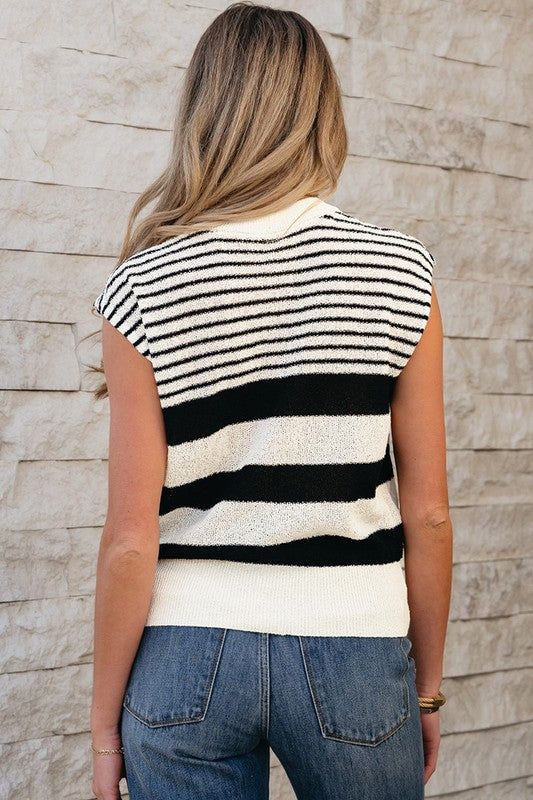 Back view of sleeveless striped sweater showing pattern and ribbed hem