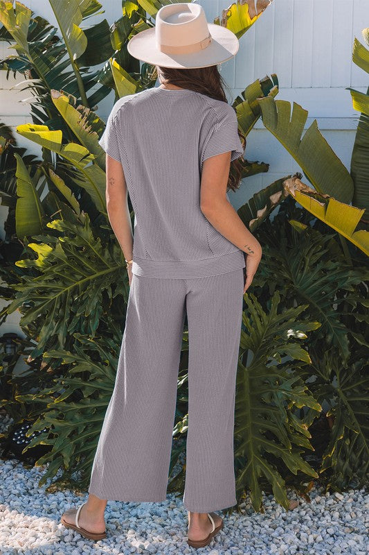 Back view of gray lounge set showing relaxed fit and wide-leg silhouette.