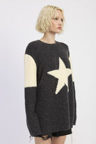 side view of charcoal and ivory star knit sweater