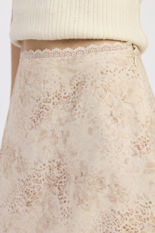 Close-up of Wild Rose layered midi skirt showing delicate rose and leopard print with lace-trimmed waist-AVAH