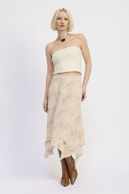 Model in Wild Rose layered midi skirt styled with knit top and boots, angled view
