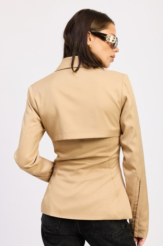 Back view of camel sculpted blazer with panel detailing and tailored fit.