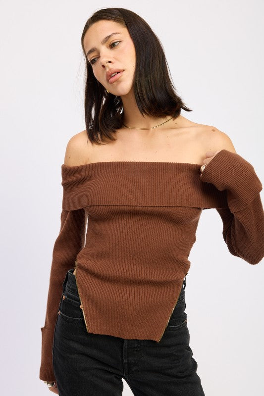 Feminine off the shoulder ribbed sweater styled for a trendy casual look, front angle