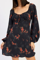 close-up of ruched bust and tie detail on black floral dress