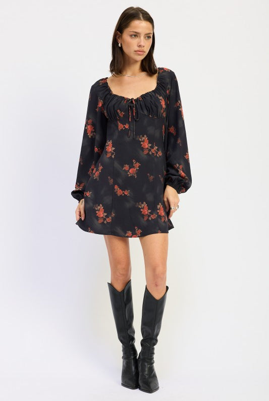 full front view of black mini dress with long sleeves and red floral print