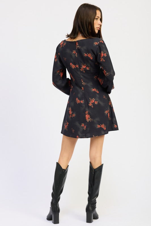 back view of black floral dress showing zipper and flattering A-line shape