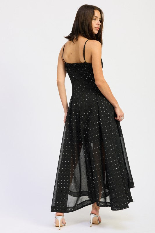 Rear view of black maxi dress with adjustable spaghetti straps, fitted bodice, and flowing dotted skirt-AVAH