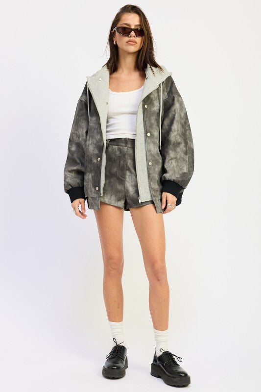 Front view of oversized washed black faux leather jacket with hood and ribbed cuffs