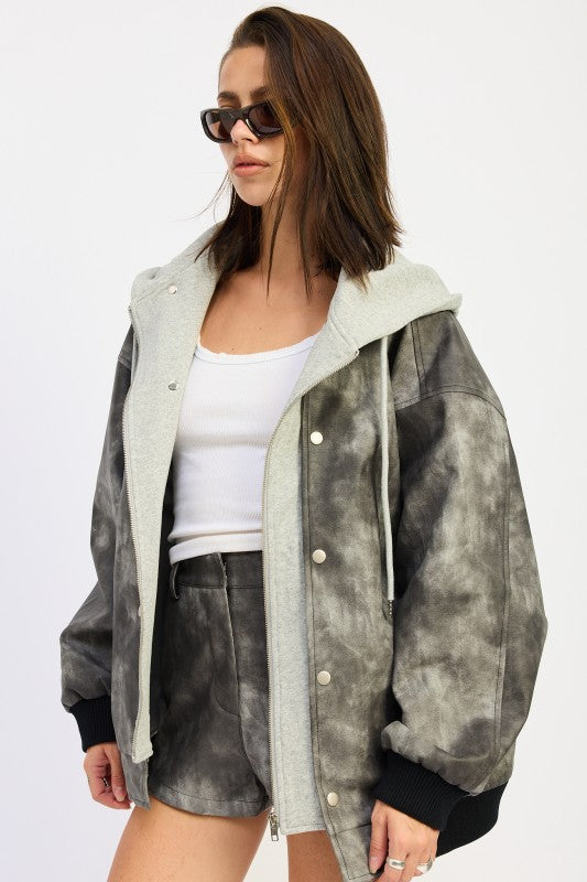 Side angle of hooded faux leather jacket showing layered texture and relaxed fit