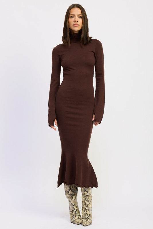Model wearing the Sienna Whisper Open-Back Knit Dress in cocoa brown, long sleeves, turtleneck, and mermaid hem.