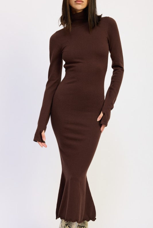 Close-up of brown knit turtleneck dress with curve-hugging fit and flared hem.