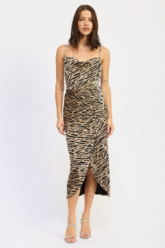Model wearing zebra print cowl neck midi dress with spaghetti straps and wrap front slit, styled with silver heels-AVAH