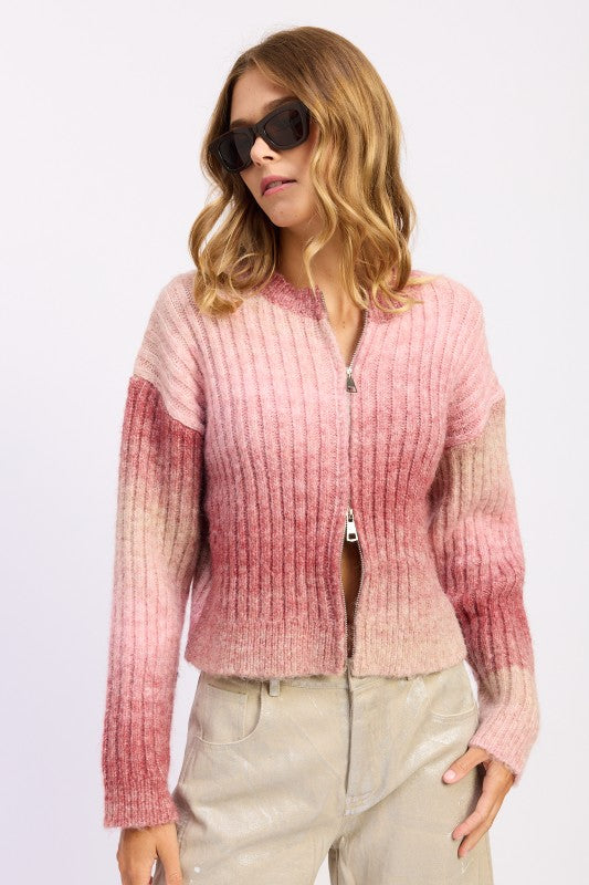 Angled view of blush gradient ribbed knit with cropped silhouette.