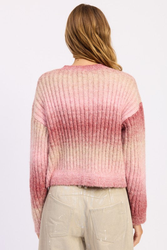 Back view showing soft fade from blush to beige on ombre sweater.