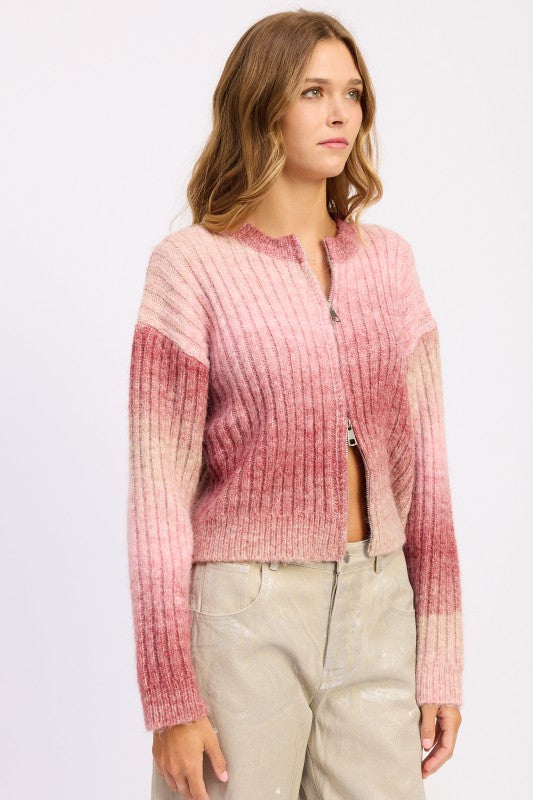 Side angle of blush gradient ribbed knit with cropped silhouette.