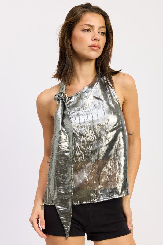 Model wearing a black silver metallic halter top with an asymmetrical knot neckline and draped front.