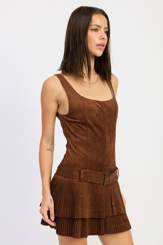 side view showing fitted suede bodice and pleated skirt