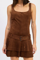 close-up of belted faux suede mini dress showing pleated skirt